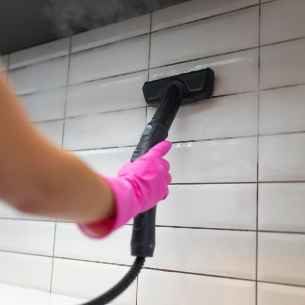 Cleaning tiles with steam machine